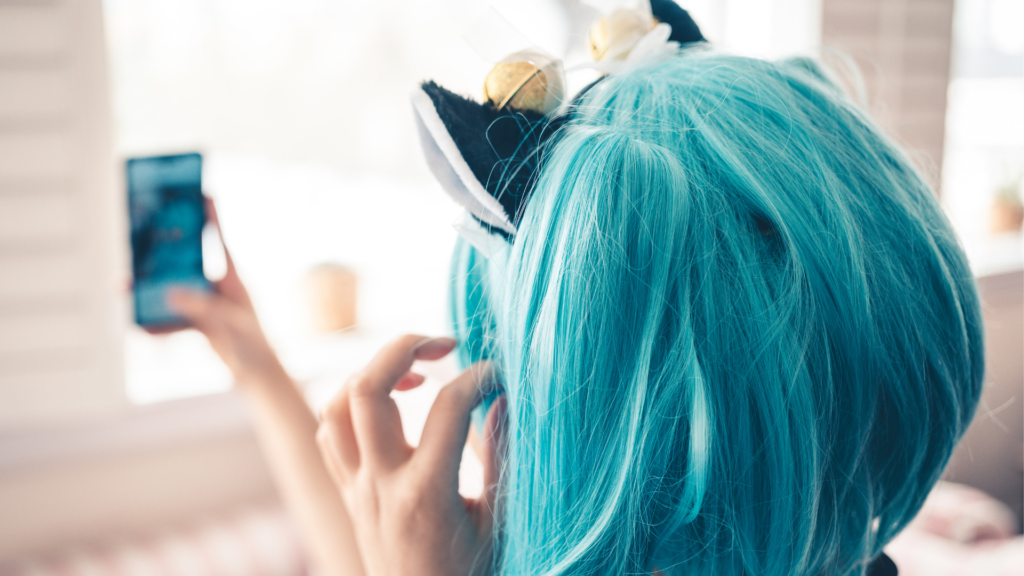 Woman in wig with cat ears taking a selfie